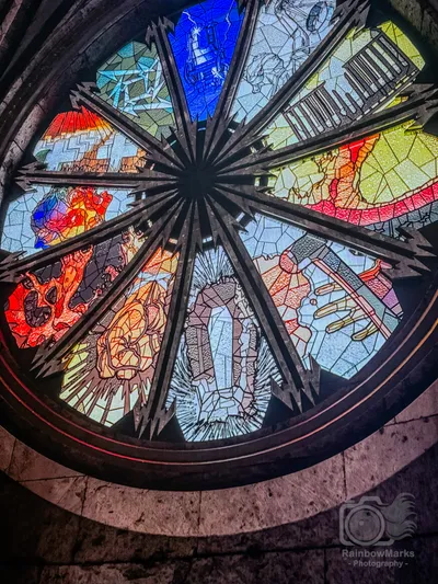 A stained glass rose window overhead