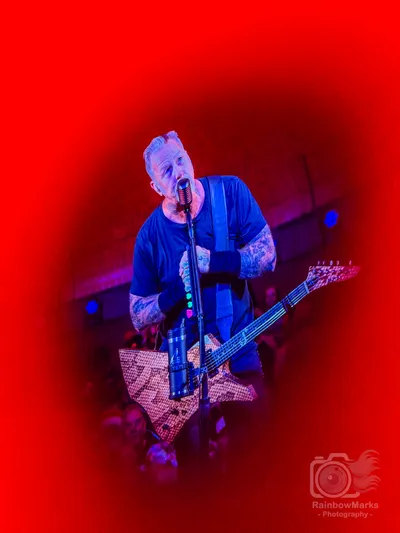 James Hetfield framed in red on the big screen