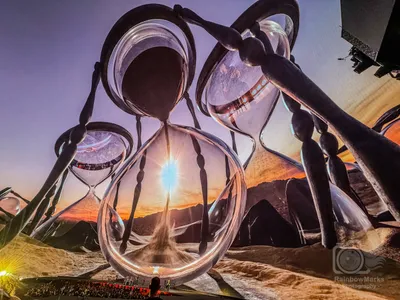Giant hourglasses in the desert at sunset