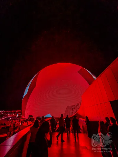 The Sphere glowing red as fans head in for the show