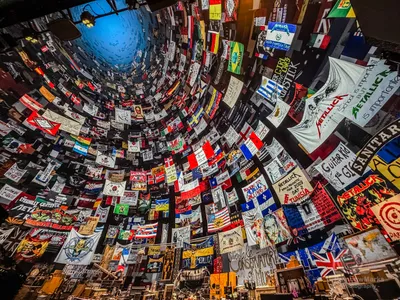 Looking up at the wall of fan flags and banners covering the Sphere